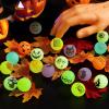 imageJOYIN 100 PCS Halloween Glow in The Dark Bouncing Balls 20 Designs Halloween Theme Glowing Bouncy Balls for Halloween Party Supplies Party Favors Trick or Treating Goodies