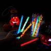 imageJOYIN 24 Pcs Halloween Glow Stick Hanging Wands in 8 Different Pattern Designs and 6 Colors for Kids Party Favors Halloween Party Supplies Glow in the Dark Goodies Bags Fillers Non Candy Treats