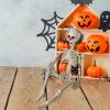 imageJOYIN 36 Halloween Skeleton Decorations with Red LED Light Eyes Plastic Bones with Movable
