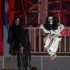 imageJOYIN 2 Pcs Halloween Hanging Swinging Ghosts Decorations Outdoor Halloween Scary Decor with Lighted Up Eyes Creepy Swinging Skeleton Flying Props for Yard Patio Lawn GardenSwinging Ghosts