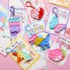 imageJOYIN 12 Packs Cards with Pop Fidget Keychain Toys Stress Anxiety Relief Fidget Toys with Cards for Kids Classroom Exchange Prizes Party Favors
