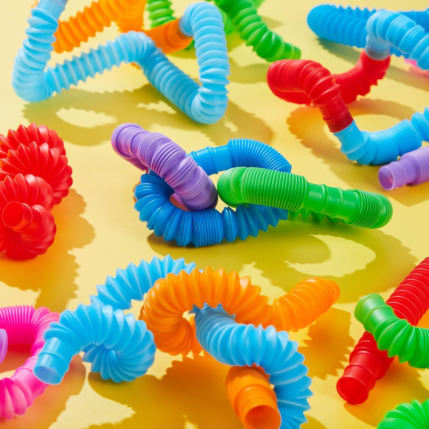 imageJOYIN 36 Pack Pop Tubes Sensory Toys Small Fidget Toys Party Favors  9 Colors Creativity Learning ampamp Fun for Toddler Kids  Perfect for Halloween Goodie Bags Classroom School RewardLarge