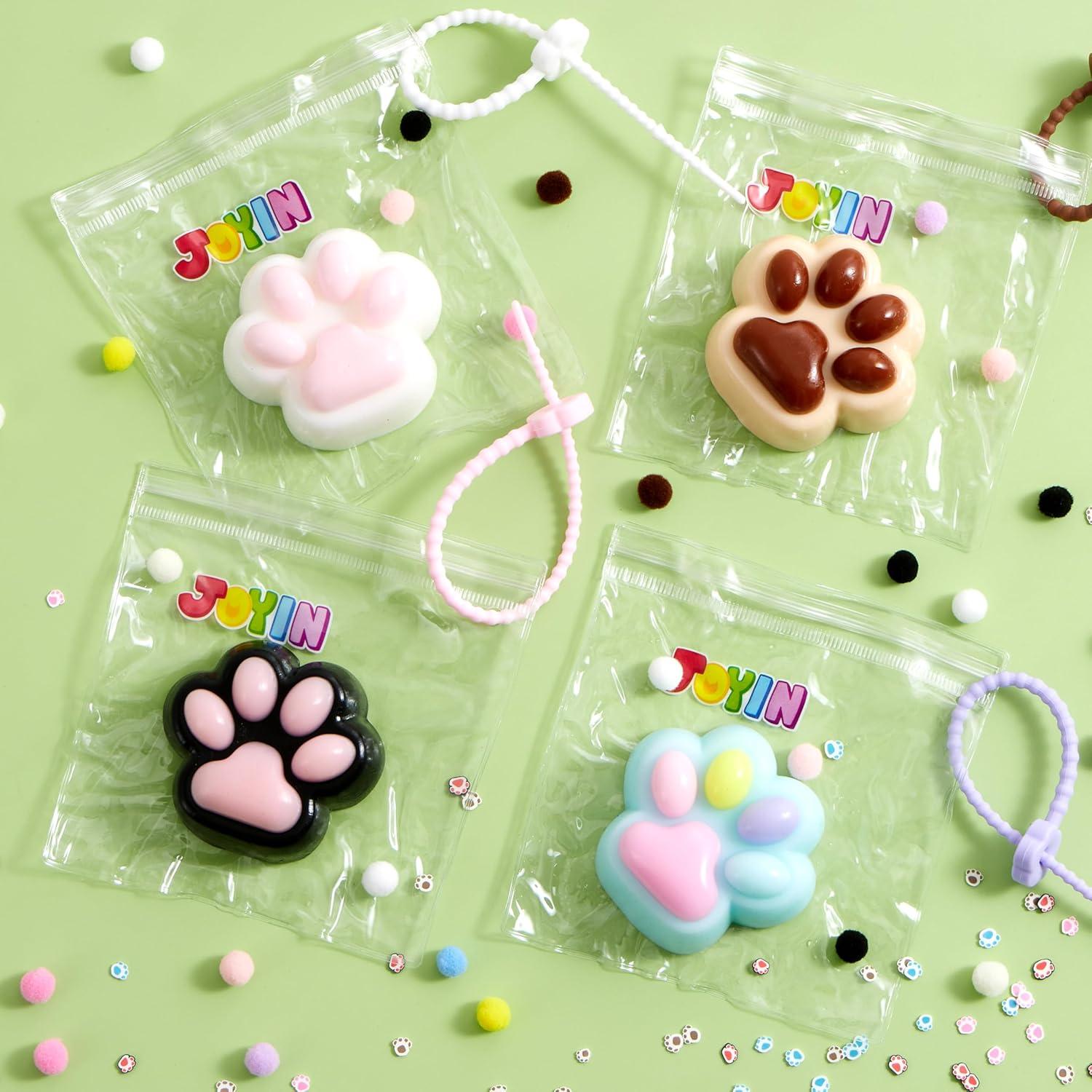 imageJOYIN 4 Pcs Taba Paw Squeeze Toys Colorful Kawaii Mochi Fufu Sensory Toys Cat Paw Taba Squeeze Toys for Party Favors Gifts for Adults Kids